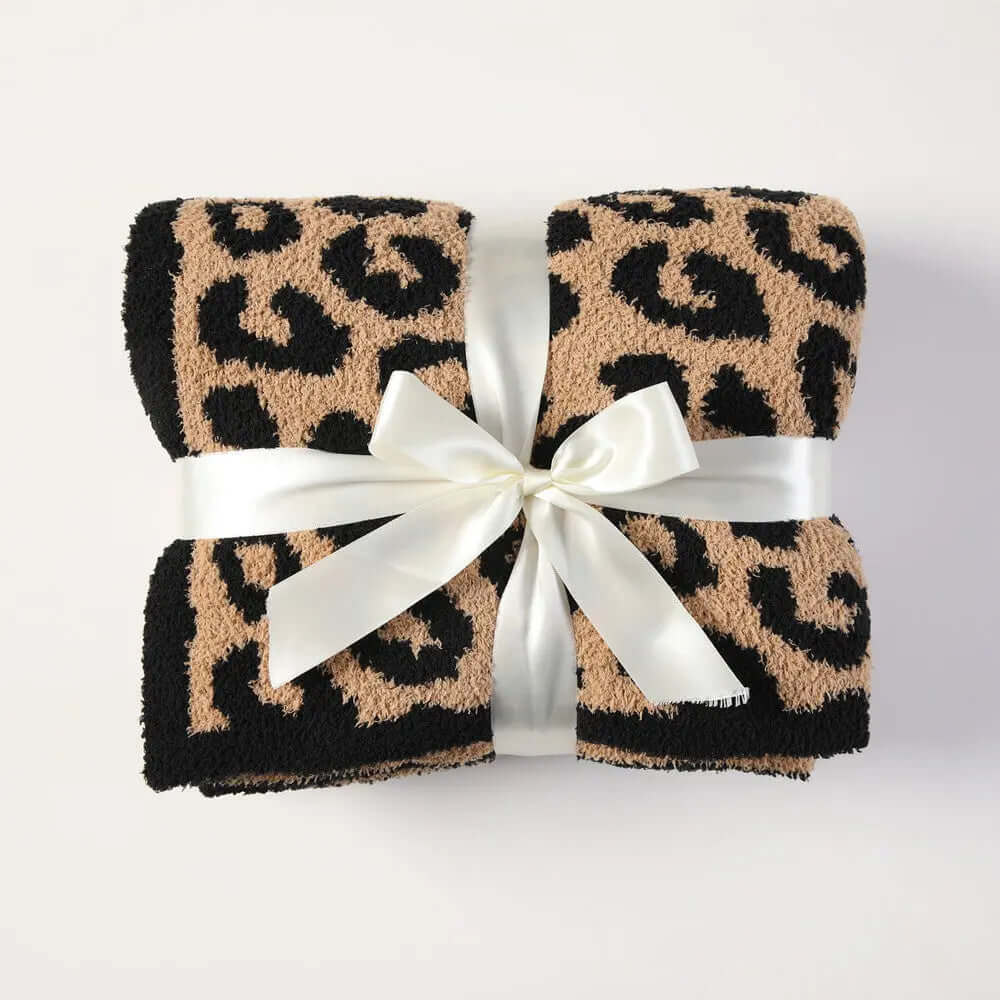 Cuddley Leopard Decorative Throw Blanket neatly packaged with a ribbon, featuring a vibrant leopard print design.