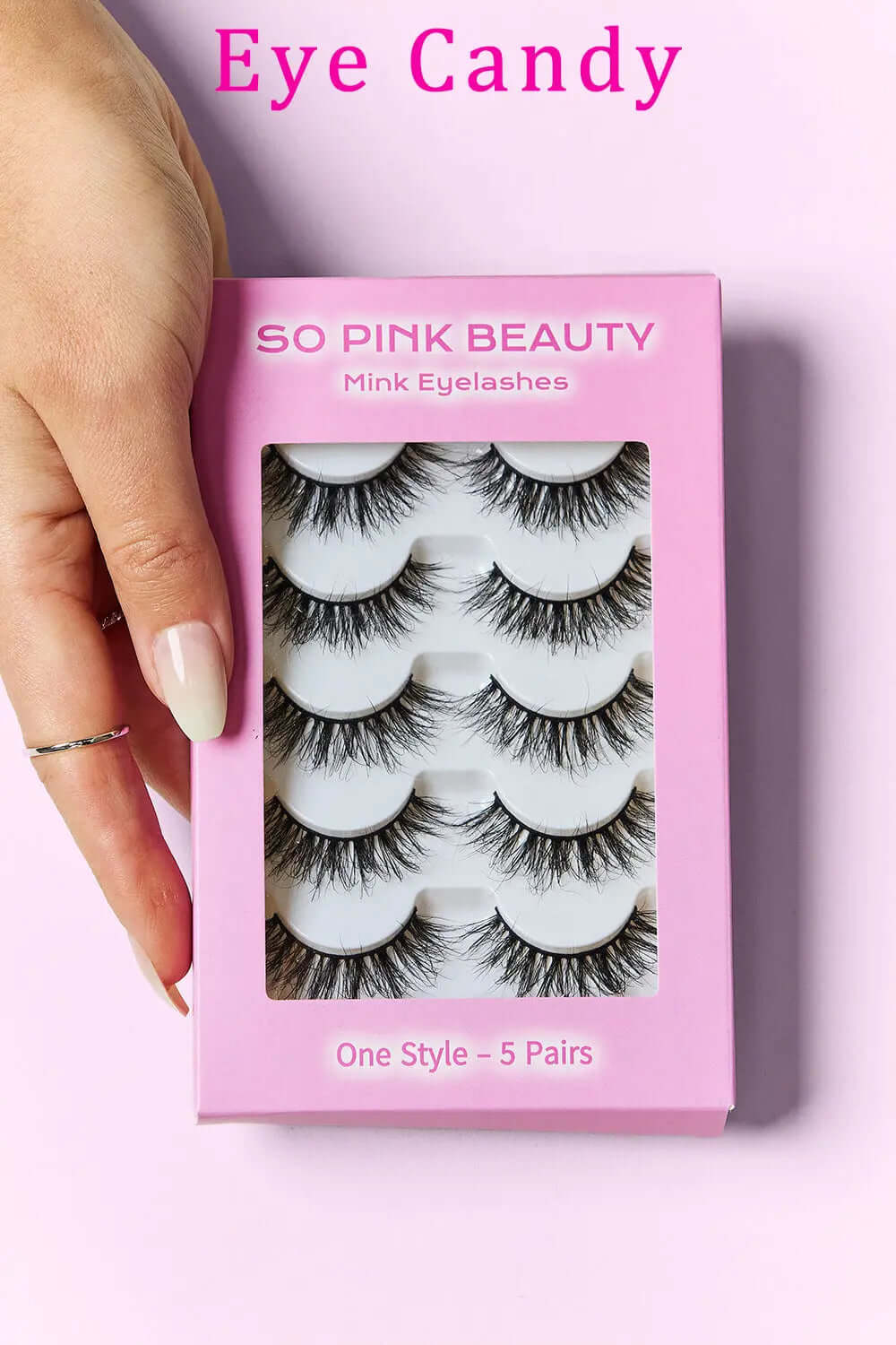 SO PINK BEAUTY Mink Eyelashes 5 Pairs packaged in pink box held by a hand, showcasing luxury and glamour for eye makeup.
