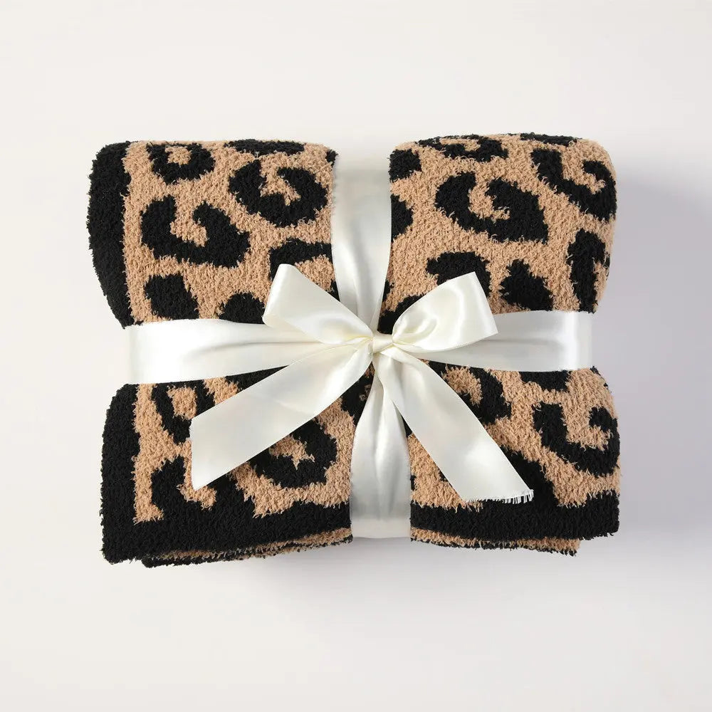 Cuddley Leopard Decorative Throw Blanket neatly packaged with a ribbon, featuring a vibrant leopard print design.