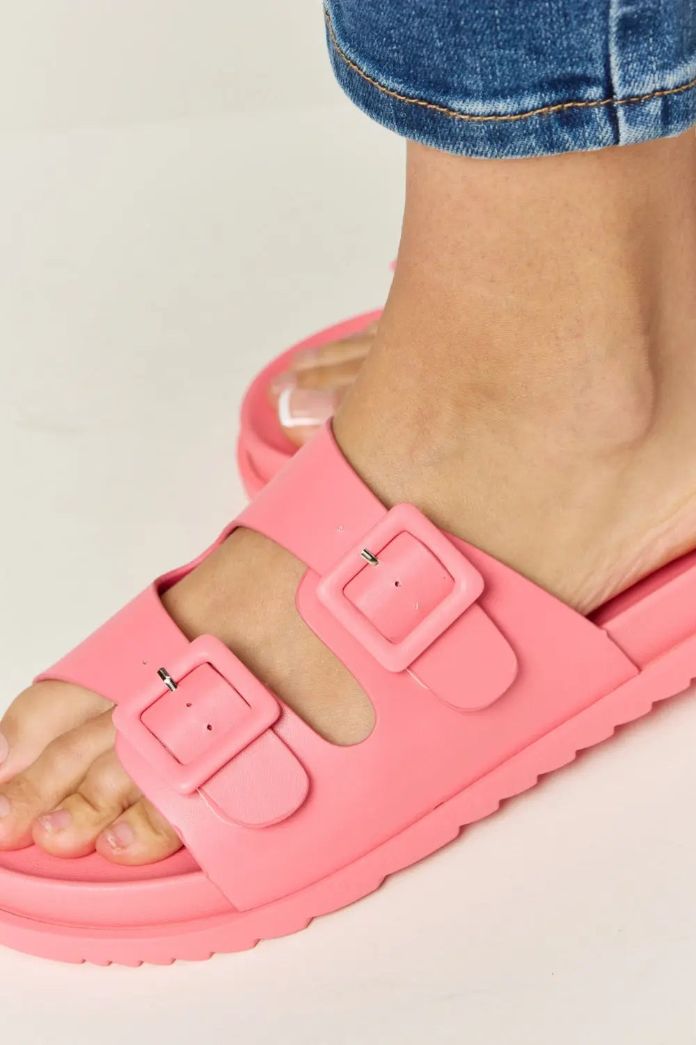 Legend Double Buckle Open Toe Sandals in vibrant pink, featuring adjustable buckles and a comfortable open toe design.